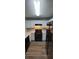 Modern kitchen featuring sleek, black appliances and bright white cabinets at 930 Parkway Rd, Union City, GA 30291