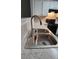 A kitchen featuring stainless steel sink, white cabinets, and modern appliances at 930 Parkway Rd, Union City, GA 30291