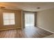 A modern living room with vinyl floors, slider doors, and neutral paint at 930 Parkway Rd, Union City, GA 30291