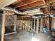 Spacious unfinished basement with brick fireplace, ductwork, and exposed framing, ready for customization at 2019 Thomasville Se Dr, Atlanta, GA 30315