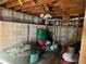 Unfinished basement featuring concrete walls and exposed ceiling beams, offering storage space and potential at 2019 Thomasville Se Dr, Atlanta, GA 30315