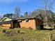 Cozy brick home featuring an enclosed porch area and a compact backyard at 2019 Thomasville Se Dr, Atlanta, GA 30315