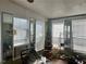 Sunroom featuring bright natural light from multiple windows and mirrored closet doors at 2019 Thomasville Se Dr, Atlanta, GA 30315
