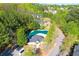Aerial view showcasing a clubhouse, pool, and landscaping adding beauty to the community at 2904 Ridgeview Sw Dr, Atlanta, GA 30331