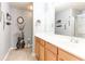 Bathroom with a light wood vanity, a large mirror, and decor offering a serene space at 2904 Ridgeview Sw Dr, Atlanta, GA 30331