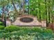 A stone sign with black plate that reads 'Stoney Pointe' in front of green bushes and tall trees at 2904 Ridgeview Sw Dr, Atlanta, GA 30331