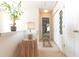 Bright hallway with a plant, decor, and white doors offering a warm and inviting transition between spaces at 2904 Ridgeview Sw Dr, Atlanta, GA 30331