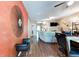 Open-concept living room with hardwood floors, decorative wall mirror, fan and a view into the living space at 2904 Ridgeview Sw Dr, Atlanta, GA 30331