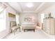 Bright main bedroom featuring trey ceiling, neutral colors, decorative wall art, and lots of natural light at 2904 Ridgeview Sw Dr, Atlanta, GA 30331