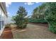 Spacious backyard featuring a well-maintained lawn and mature trees at 3915 Deerborne Dr, Cumming, GA 30040