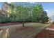 Lush backyard featuring mature trees and green space perfect for outdoor activities and relaxation at 3915 Deerborne Dr, Cumming, GA 30040