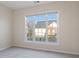 Bedroom featuring large window with view of neighborhood at 3915 Deerborne Dr, Cumming, GA 30040