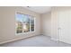 Bedroom with a large window allowing natural light and a neutral color palette at 3915 Deerborne Dr, Cumming, GA 30040
