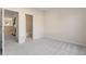 Carpeted bedroom showcasing neutral paint and open doorway leading into the bathroom at 3915 Deerborne Dr, Cumming, GA 30040