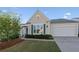 Charming home with manicured lawn, attached garage and inviting curb appeal at 3915 Deerborne Dr, Cumming, GA 30040