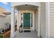 Inviting front porch with decorative wreath and lantern, creating a warm and welcoming entrance at 3915 Deerborne Dr, Cumming, GA 30040