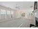 Bright and open living room featuring neutral tones, a ceiling fan, and fireplace at 3915 Deerborne Dr, Cumming, GA 30040