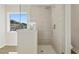Shower with glass doors and tile surround at 5620 Weddington Drive Dr, Cumming, GA 30040