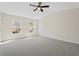 Large bedroom with carpeted floor and lots of natural light at 5620 Weddington Drive Dr, Cumming, GA 30040