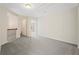 Upstairs bonus room with neutral paint and carpet at 5620 Weddington Drive Dr, Cumming, GA 30040
