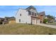 Lovely two-story home featuring a brick and siding exterior, two-car garage, and spacious front yard at 5620 Weddington Drive Dr, Cumming, GA 30040