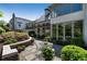 Charming backyard patio includes outdoor seating, lush landscaping, and ample sunlight at 123 Peachtree Cir, Atlanta, GA 30309