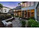 Inviting backyard patio offers a stone surface, outdoor seating, and meticulously maintained landscaping at 123 Peachtree Cir, Atlanta, GA 30309