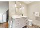 Stylish bathroom featuring pendant lights, white vanity and decorative tiled floor at 123 Peachtree Cir, Atlanta, GA 30309