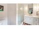 Bright bathroom with a glass shower, patterned tile floor and white vanity at 123 Peachtree Cir, Atlanta, GA 30309