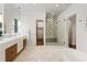 Bright bathroom featuring marble floors, a glass-enclosed shower with patterned tile and a soaking tub at 123 Peachtree Cir, Atlanta, GA 30309
