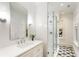 Bathroom featuring a glass shower, modern vanity, and patterned tile floors for a fresh and clean aesthetic at 123 Peachtree Cir, Atlanta, GA 30309