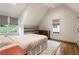 Bright bedroom with hardwood floors, built in shelving and two large windows at 123 Peachtree Cir, Atlanta, GA 30309