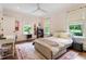 Bedroom with a comfortable bed, desk, large windows and a soft, neutral-toned rug at 123 Peachtree Cir, Atlanta, GA 30309