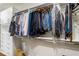 Organized walk-in closet with hanging clothes, shelving, and drawers for ample storage and organization at 123 Peachtree Cir, Atlanta, GA 30309