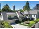 Stunning exterior elevation features lush landscaping and the city skyline as a backdrop at 123 Peachtree Cir, Atlanta, GA 30309