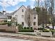 Beautiful home with brick wall, manicured landscaping, walkway, and steps up to the front entrance at 123 Peachtree Cir, Atlanta, GA 30309