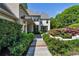 Charming front entrance with stone walkway, lush bushes, and vibrant azaleas at 123 Peachtree Cir, Atlanta, GA 30309