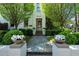 Inviting home entrance with stone walkway, lush landscaping, and elegant flower planters at 123 Peachtree Cir, Atlanta, GA 30309