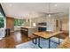 Spacious eat-in kitchen featuring a large island, stainless steel appliances, and modern lighting fixtures at 123 Peachtree Cir, Atlanta, GA 30309