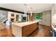 This open concept kitchen features a large island, stainless steel appliances, and modern cabinetry at 123 Peachtree Cir, Atlanta, GA 30309