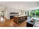 Modern open concept kitchen with large island, barstool seating, and stainless steel appliances at 123 Peachtree Cir, Atlanta, GA 30309