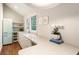 Charming kitchenette featuring white countertops, a retro refrigerator, and hardwood floors at 123 Peachtree Cir, Atlanta, GA 30309