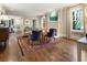 Inviting living room with hardwood floors, a decorative rug, neutral walls, and comfortable seating near a fireplace at 123 Peachtree Cir, Atlanta, GA 30309