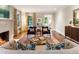 Inviting living room features a fireplace, hardwood floors, a rug, and neutral walls, creating a comfortable atmosphere at 123 Peachtree Cir, Atlanta, GA 30309