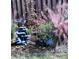 Charming backyard garden decor with decorative water feature and ornamental foliage at 15 Masters Dr, Villa Rica, GA 30180