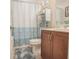 Well-maintained bathroom featuring a vanity with updated fixtures, plus a toilet and shower with curtain at 15 Masters Dr, Villa Rica, GA 30180