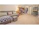 Comfortable bonus bedroom with a cozy seating area, built-in bookcase, and access to closet space at 15 Masters Dr, Villa Rica, GA 30180