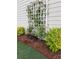Exterior view of white siding with lattice accent and lush landscaping at 15 Masters Dr, Villa Rica, GA 30180
