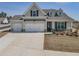 Charming home featuring a three-car garage, a combination of stone and siding accents, with a well-manicured lawn at 15 Masters Dr, Villa Rica, GA 30180