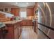 Gourmet kitchen featuring stainless steel appliances, granite countertops, and wooden cabinets at 15 Masters Dr, Villa Rica, GA 30180